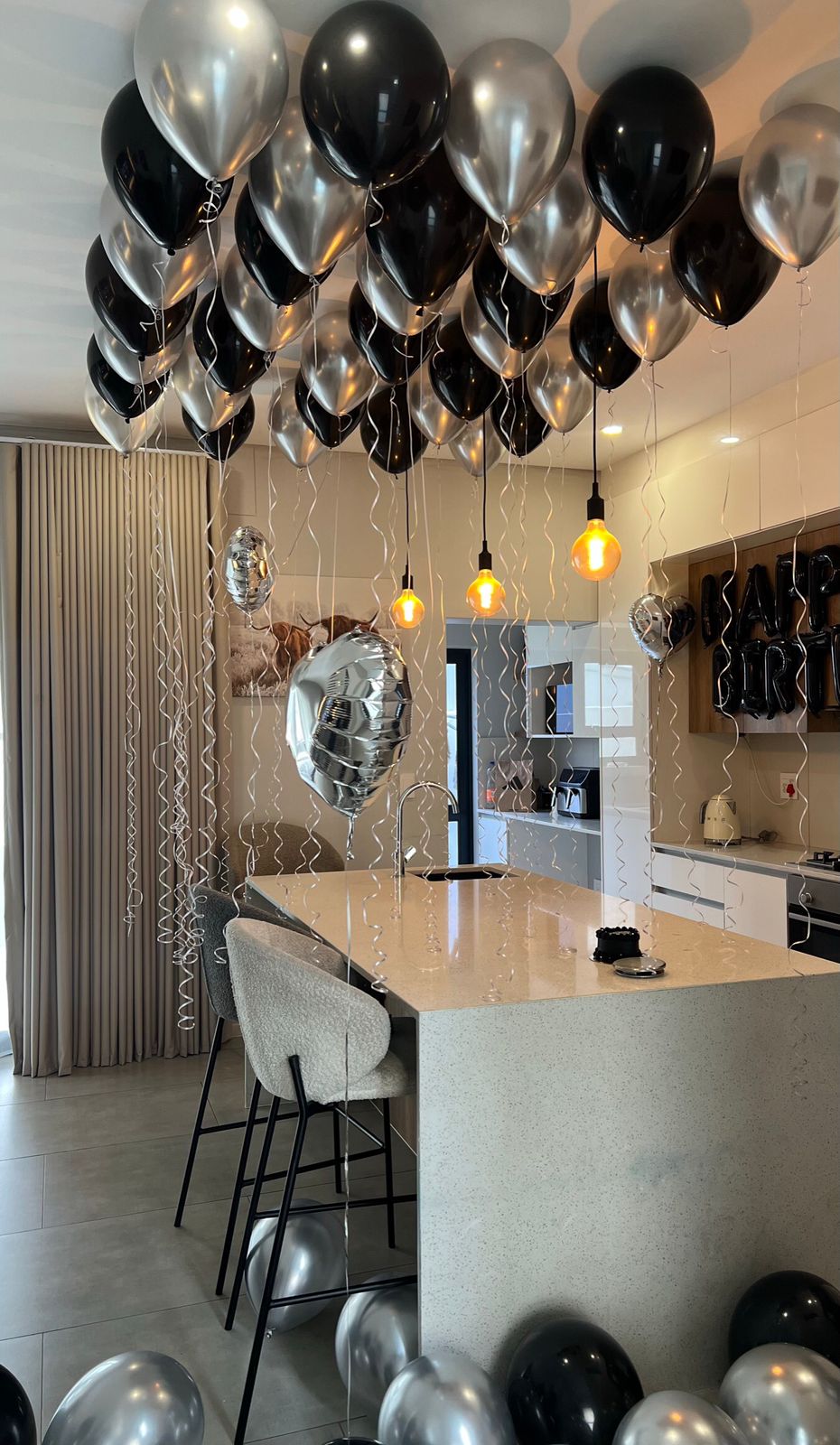 Black and silver ceiling birthday setup
