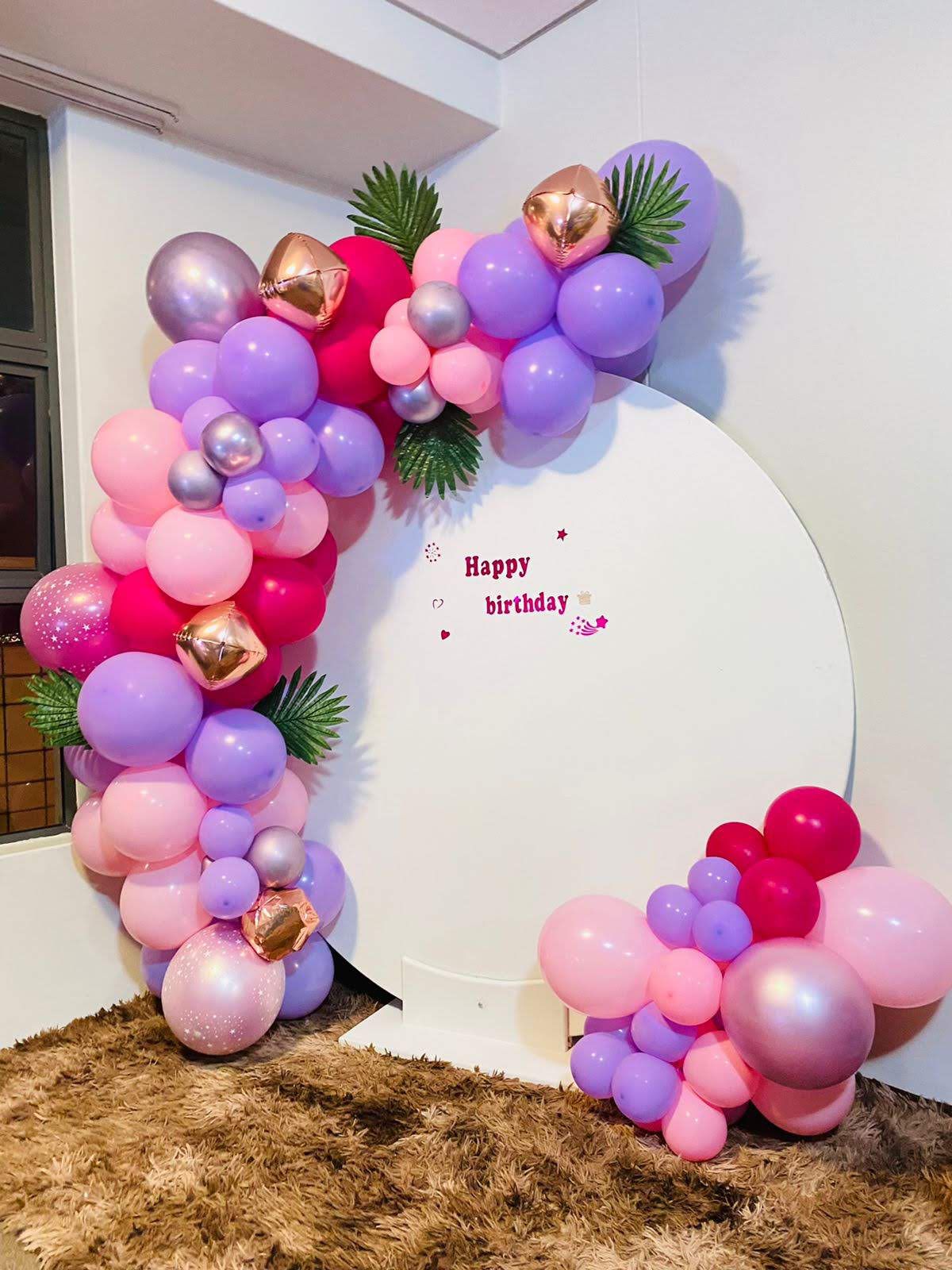 Purple birthday balloon arch